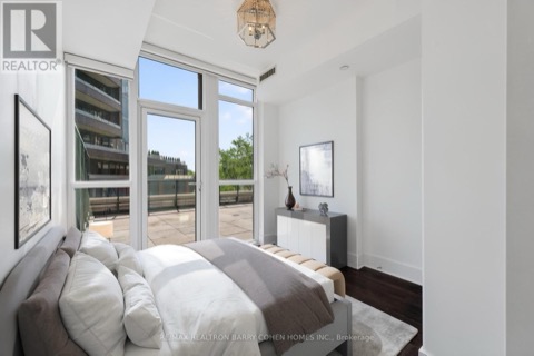 Second bedroom with terrace doors and city trees