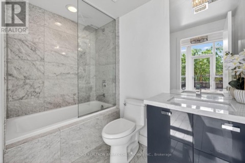 Primary ensuite with marble surround and rainfall shower