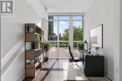 Den staged as a home office with terrace light
