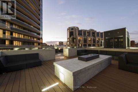 Building rooftop amenity terrace at dusk